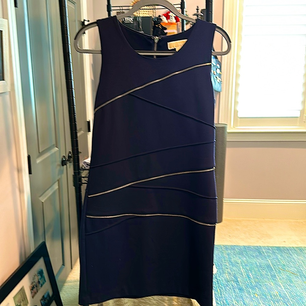 This is a Michael kors black sleeveless cotton knit dress in a size 4.